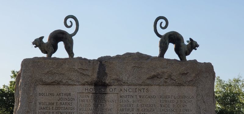Two Bronze Cats Watch From Above Two Bronze Cats Watch From Above