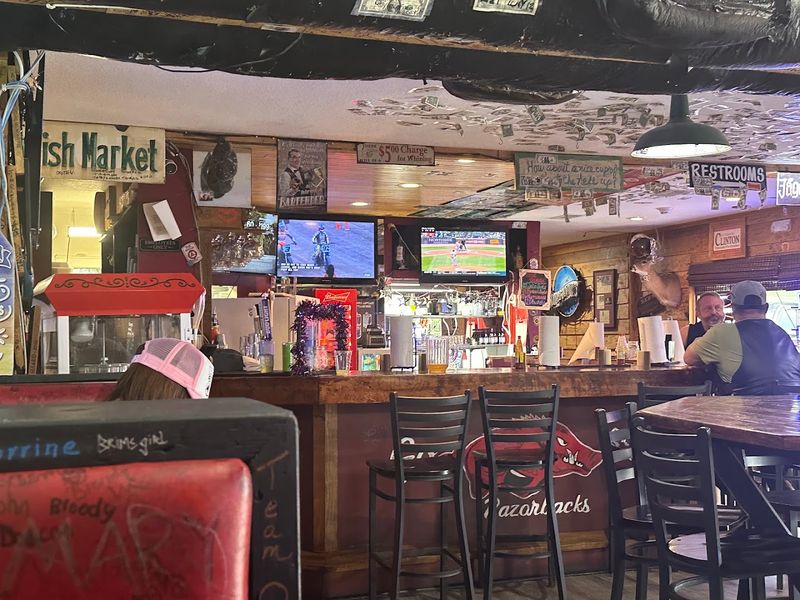 Dollar Bills And Graffiti Cover The Walls