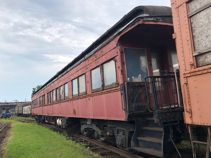 Vintage Locomotives And Passenger Cars Across The Yard