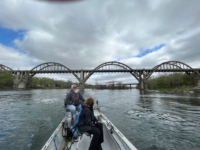 Drift Boats Sliding Past Limestone Banks