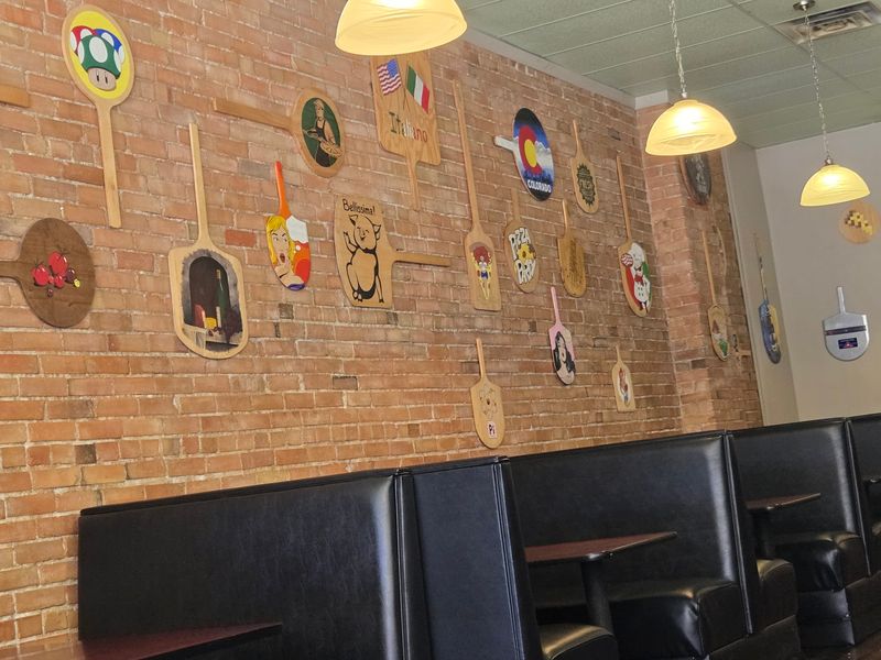 Walls Covered In Painted Pizza Peels And Other Small Surprises