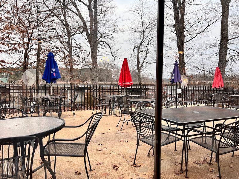 Faded String Lights Flicker On Against A Copper Sky