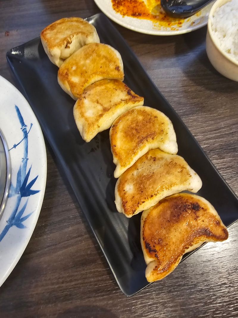 Watch The Dumpling Makers Work Their Magic Through The Glass