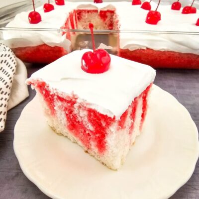 You will need the following items to make this recipe: Measuring cups, large bowl and mixer or stand mixer, silicone spatula, 9x13 cake pan, skewer sticks or large fork, medium saucepan, whisk Ingredients: ● 1 box (13.25 oz) white cake mix, plus ingredients listed on the box (ours called for 1 ¼ cups water, ½ cup oil, 4 eggs whites) ● 3 oz box cherry Jell-O ● 1 cup boiling water ● 1 cup cold water ● 8 oz whipped topping ● 12 maraschino cherries Directions: 1. Preheat the oven to 350 degrees, and grease a 9x13 inch baking dish. 2. In a large bowl, beat the cake mix, water, oil, and egg whites for 3 minutes. 3. Bake for 35 minutes, or until a toothpick inserted into the center of the cake comes out clean. 4. Remove the cake from the oven, and allow to cool for 5-10 minutes. 5. Poke holes all over the cake every ½ inch or so using a skewer stick or large fork. 6. Prepare the jello by bringing 1 cup of water to a boil, and stirring in the gelatin until dissolved. Stir in another 1 cup of water, and whisk for 3 minutes. 7. Slowly pour the prepared liquid over the cake, allowing it to absorb into the holes. 8. Refrigerate for 4 hours. 9. To serve, top with whipped topping and maraschino cherries.