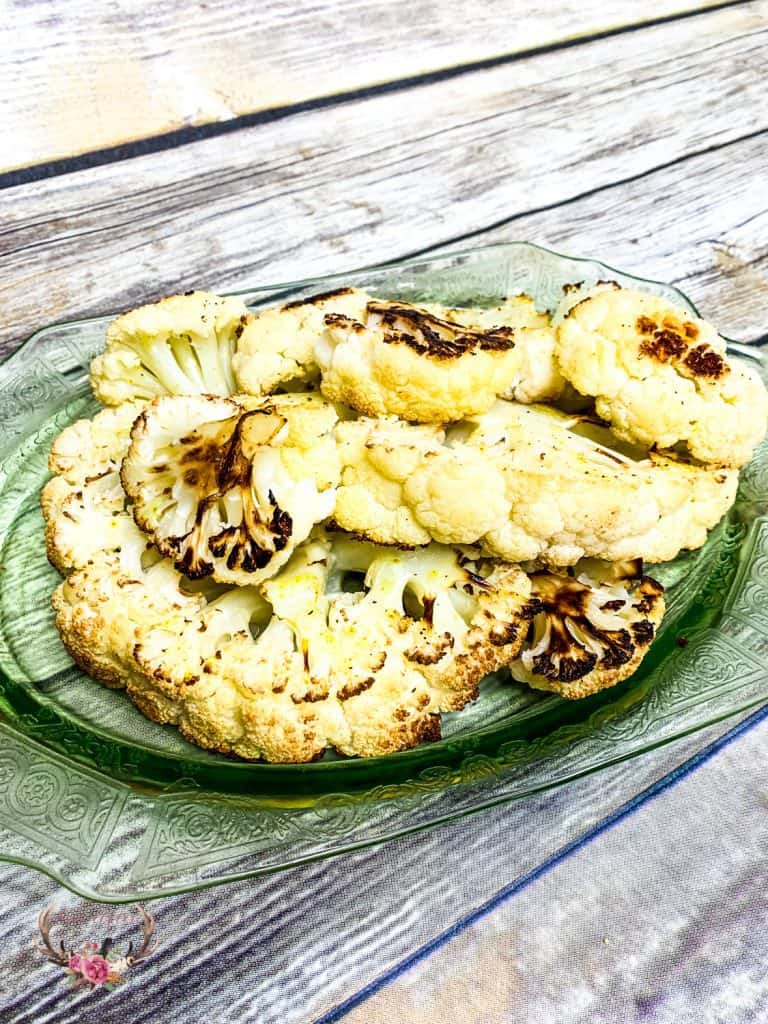 I think I may have just made the best roasted cauliflower ever! The cauliflower is soft and sweet with caramelized edges – It is so good, I may or may not have eaten the entire head of cauliflower myself.