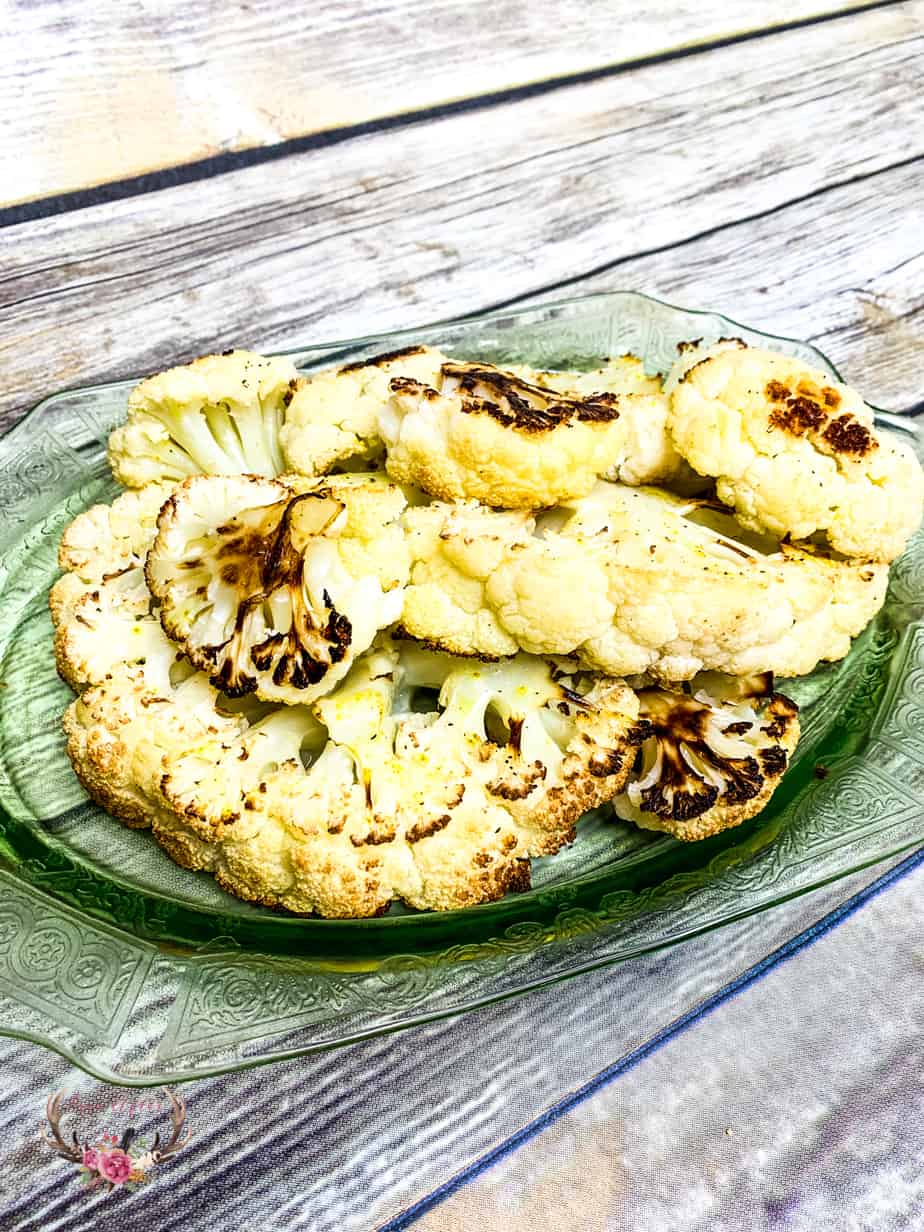I think I may have just made the best roasted cauliflower ever! The cauliflower is soft and sweet with caramelized edges – It is so good, I may or may not have eaten the entire head of cauliflower myself.