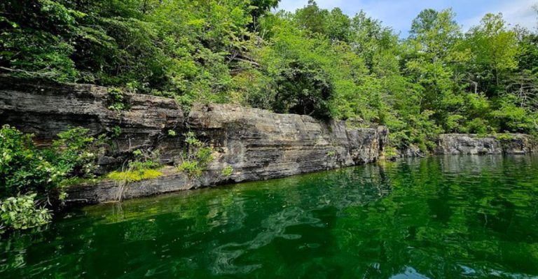 This Indiana Quarry Campground Has Blue-Green Water, Floating Obstacles, And Summer Adventure